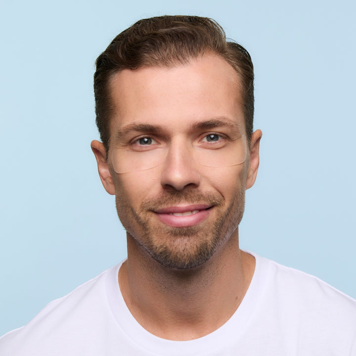Men's eye wrinkle patch applied under the eye, a non-invasive alternative to aesthetic treatments for crow's feet